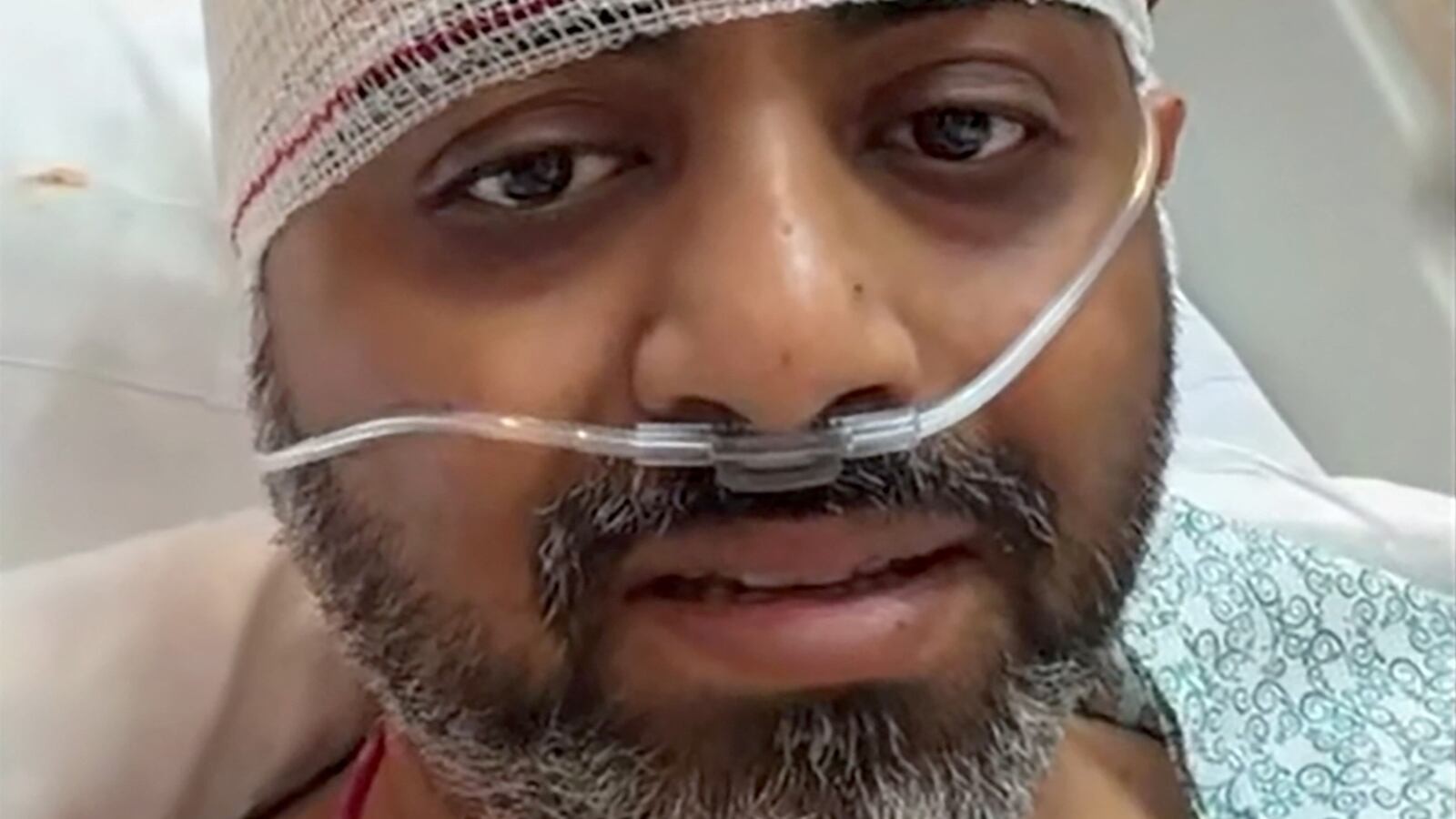 Captain Smit Machchhar speaking from his hospital bed, his head bandaged